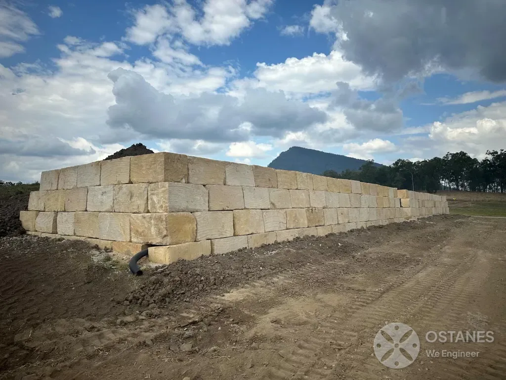 Long run of sandstone block retaining wall in south-east Queensland